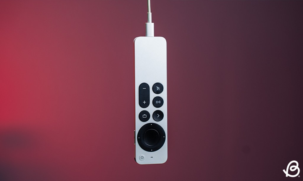 Apple TV remote plugged in for charging