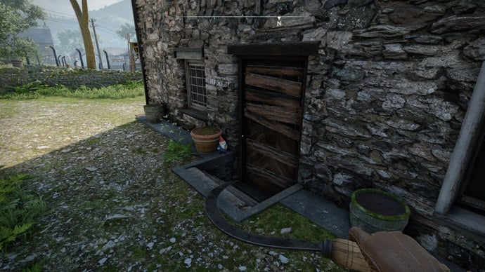 The player looks at a gnome sat on a doorstep beside a plant pot in Wyndham Village in Atomfall