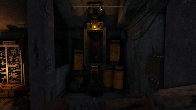 The player looks at a Pneumatic Dispatch Tube inside of the Casterfell Woods Remote Bunker in Atomfall